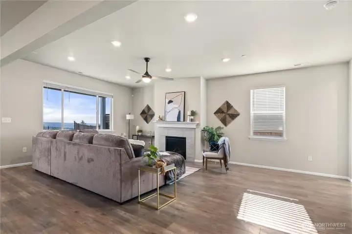 Spacious main living area with a comfortable layout, large windows, and a clean, open feel