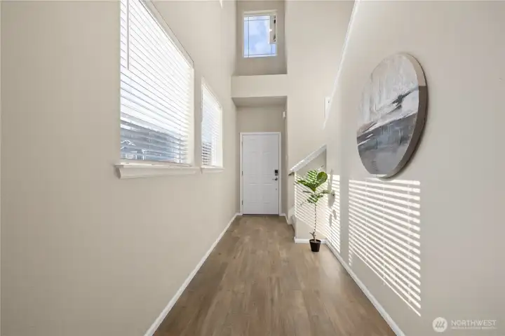 Welcoming entry and staircase create a clean transition into the main living areas