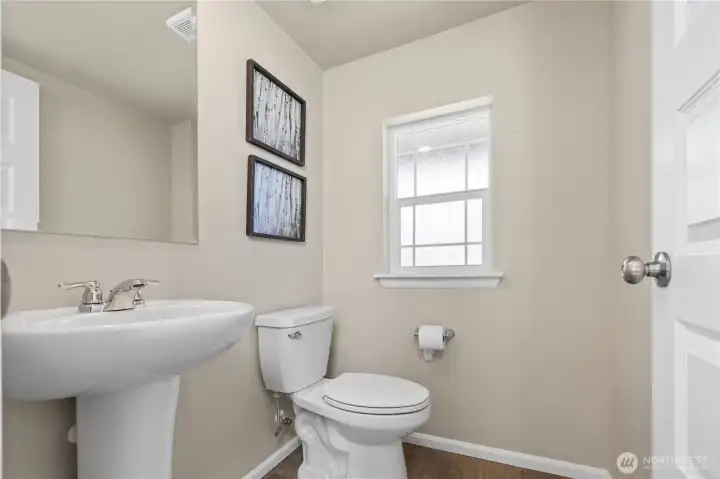 Main-level powder room convenient for entertaining