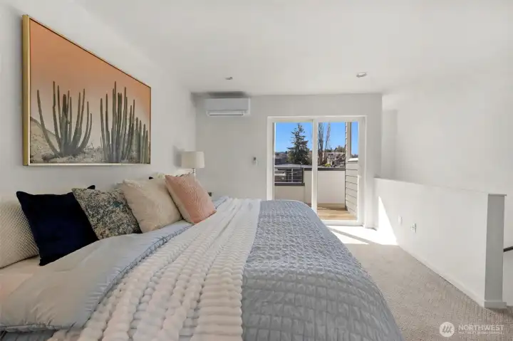 This top-floor retreat perfectly balances indoor luxury with an outdoor escape, offering a quiet vantage point high above the neighborhood.