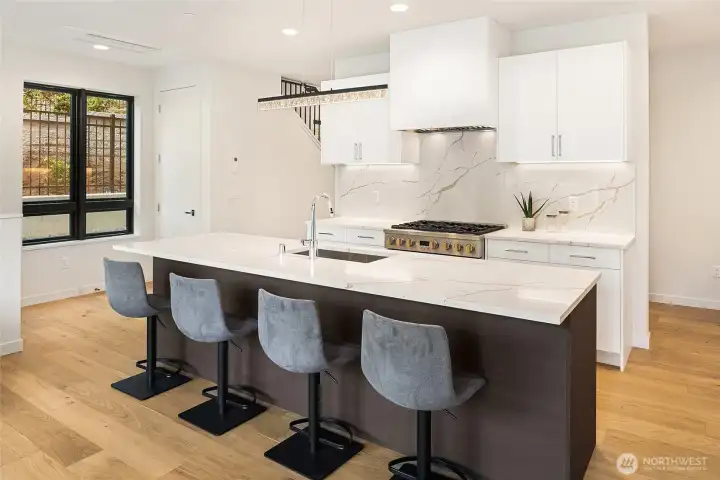 Spacious island with seating. Perfect for gatherings and casual dining.