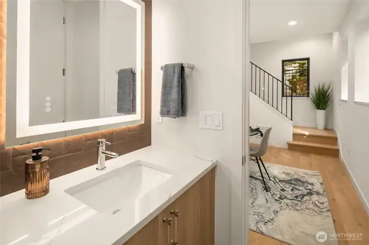 Guest powder room conveniently located on main floor