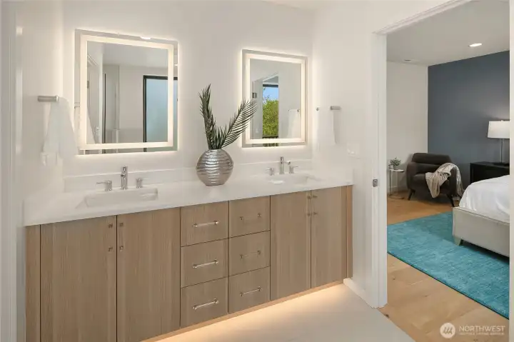 Spacious primary bathroom with double b=vanity and modern finishes
