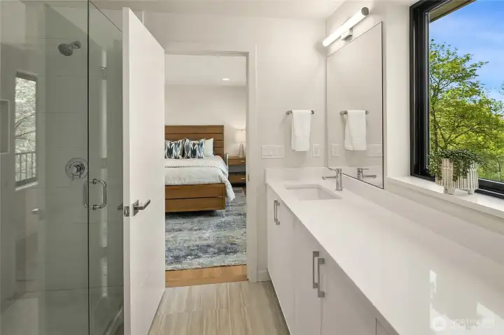 En suite bathroom  with clean lines and finishes and natual light