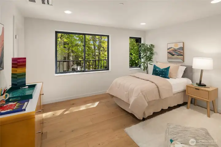 Well sized bedroom with gardens located outside for more privacy  and a comfortable layout