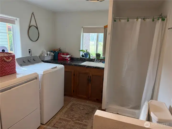 Another look at the combo bathroom/laundry room. Another look at the combo bathroom/laundry room.