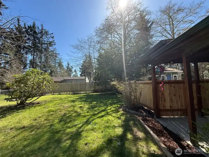 Here you see part of the covered patio and the southwest corner of the backyard. Again, PLENTY of space. Here you see part of the covered patio and the southwest corner of the backyard. Again, PLENTY of space.