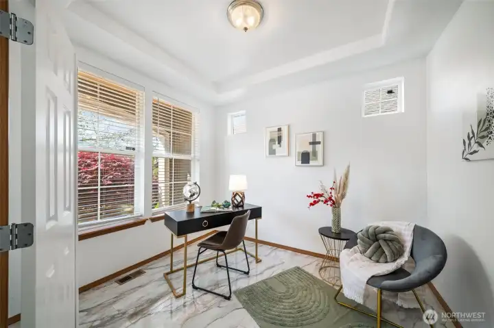 Front den would be great for a home office space or reading room.