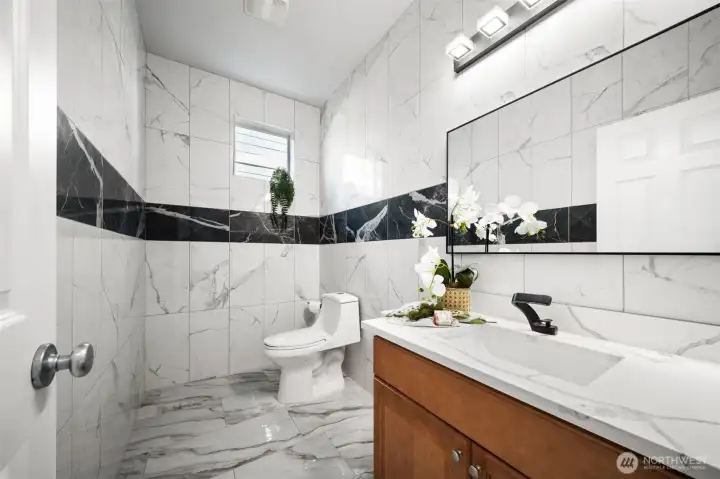 Spacious half bath on main floor for convenience.
