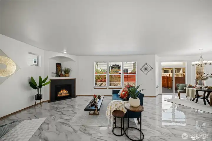 Light-filled living room opens up to the kitchen and dining area.