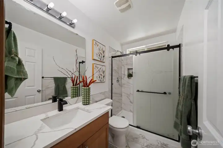 Second floor hallway bathroom provides plenty of space.