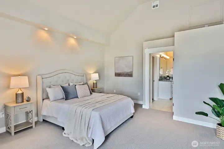Spacious main level primary suite with 5 piece bath and large walk in closet