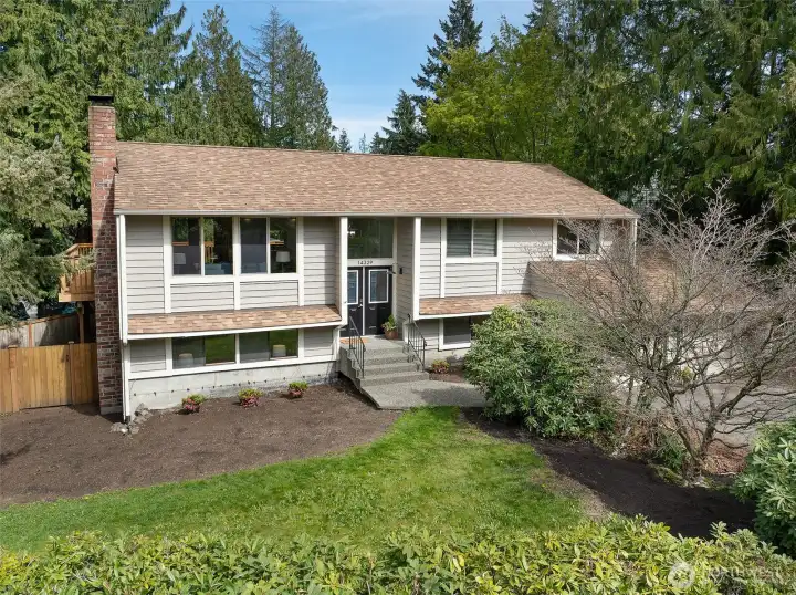 Tucked at the end of a quiet cul-de-sac near Lake Serene, this lovely split-level home offers privacy, space, and a peaceful setting