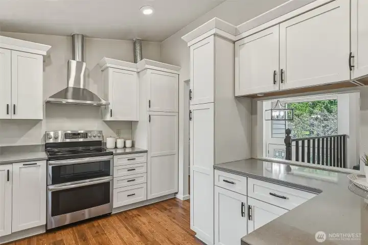 Cook's dream! Kitchen was updated in 2021 and has custom cabinets. Easily store your cookie sheets, appliances, dishes, and gadgets. There's even a pull-out stepstool!