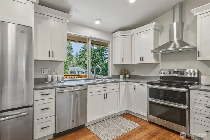 New Stainless Steel appliances, and 2 ovens in the range.