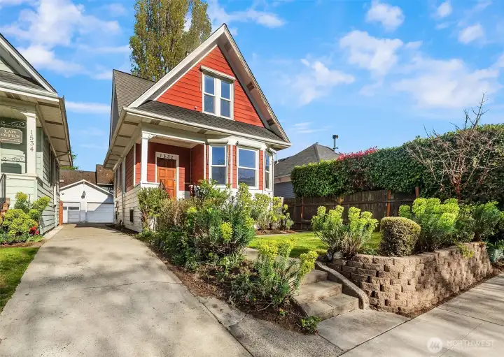 Spacious front yard, driveway parking, detached garage & carport.