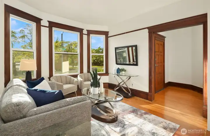 Large windows providing for a light filled living room upon entry.