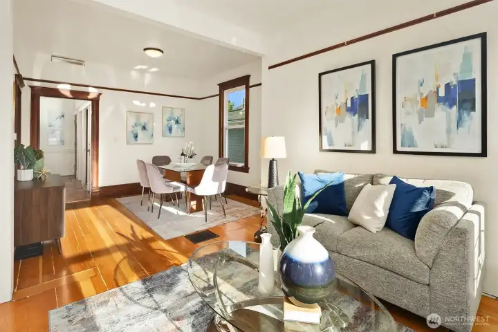 Living room with seamless flow into dining area.