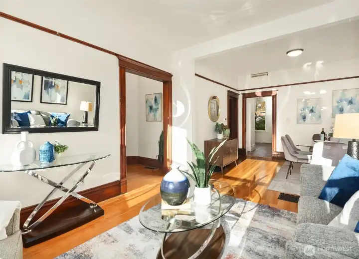 Living room with seamless flow into dining area.