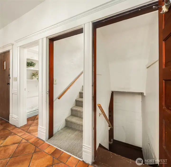 Kitchen with walk in pantry, access to upstairs, and unfinished basement.