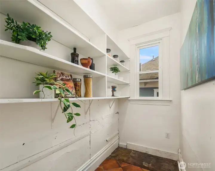 Walk in pantry with built in shelving.