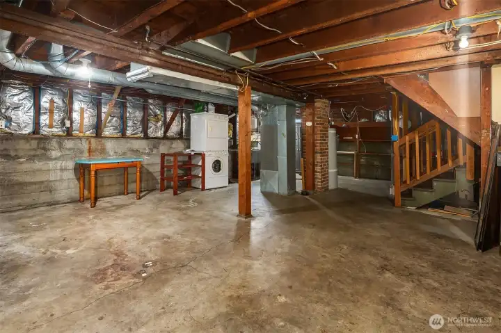 Unfinished basement offers storage and future finished potential.