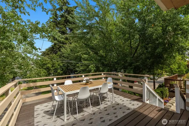 Sunny deck in front is a lovely place to sip your morning coffee. Sunny deck in front is a lovely place to sip your morning coffee.