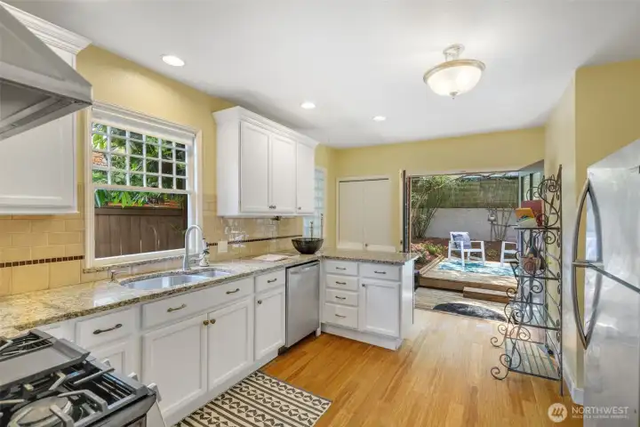 French doors from the kitchen lead out to your own backyard. French doors from the kitchen lead out to your own backyard.