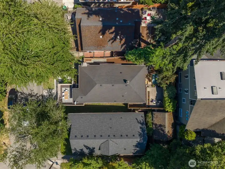 Aerial view showing front deck and backyard. Aerial view showing front deck and backyard.