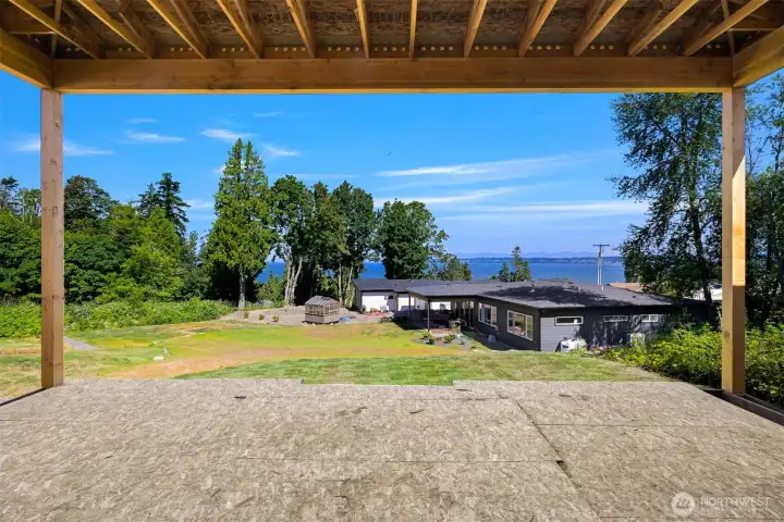 Relax and unwind on the covered outdoor deck while enjoying breathtaking sunsets and water views.