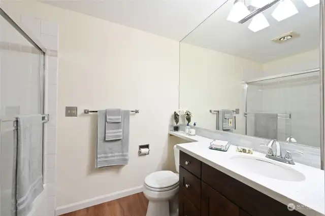 Updated main bathroom with new counter, fixtures and tile.