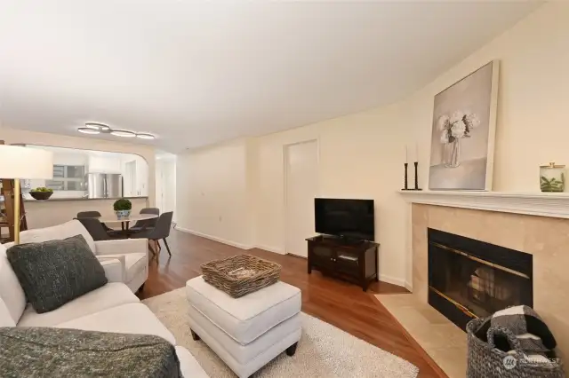 Living room is accentuated with cozy wood fireplace.