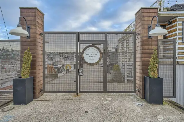 As you enter Lake Union Landing gated community dock you will be amazed at the ten foot wide dock lined with trees and benches...