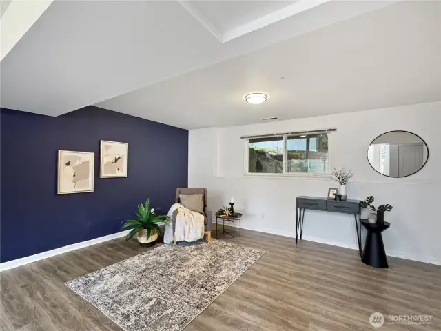 This floor has a spacious living space, laundry room with half bath, and garage access.