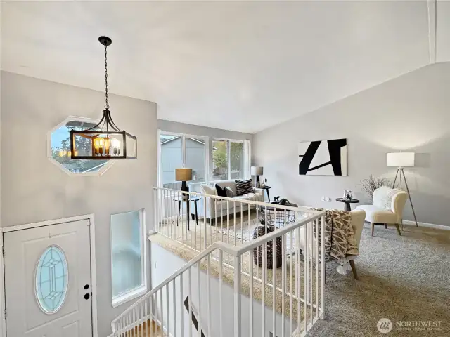 Upon entry you're greated with soaring vaulted ceilings and an open floorplan.