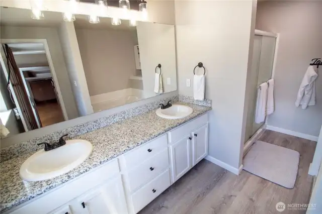 The primary ensuite features dual sinks, jetted soaking tub & walk-in shower!