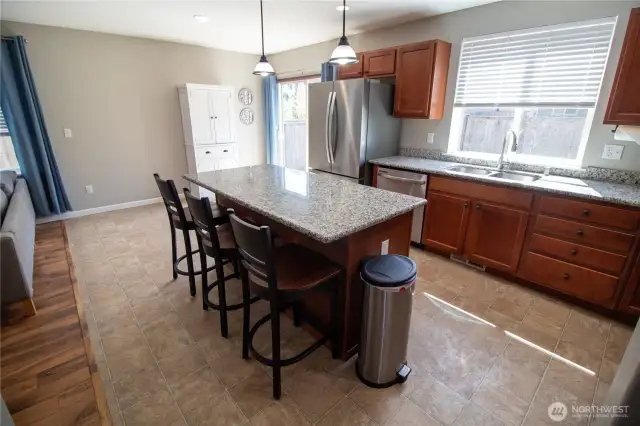 Check out the beautiful kitchen, which also leads to the backyard!