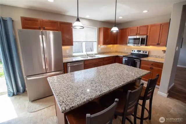 Beautiful counters, lots of cabinet storage, and stunning under-cabinet lighting!
