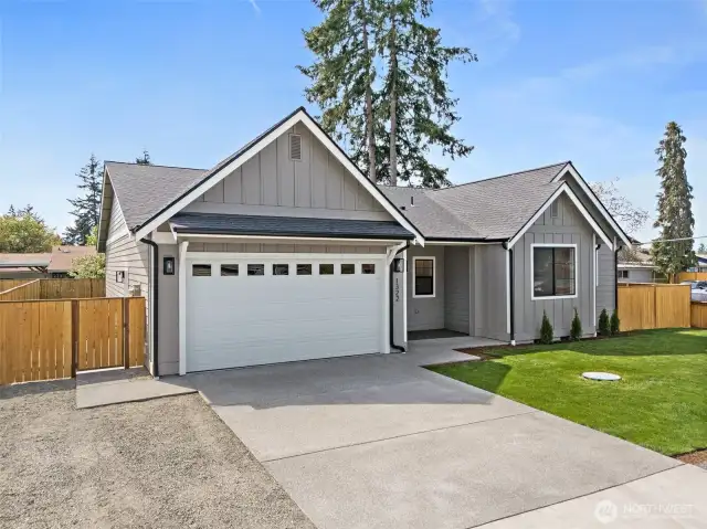 Nestled on a large corner lot with No HOA! Beautiful landscaping and lots of room for parking.