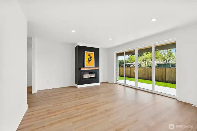 The stunning focal point of the Great room is the stylish fireplace. Cozy up with a good book and relax. Shown here unfurnished to appreciate the massive space.