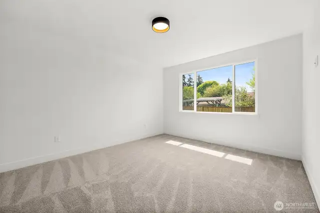 Primary suite shown unfurnished to appreciate the magnitude of the space.