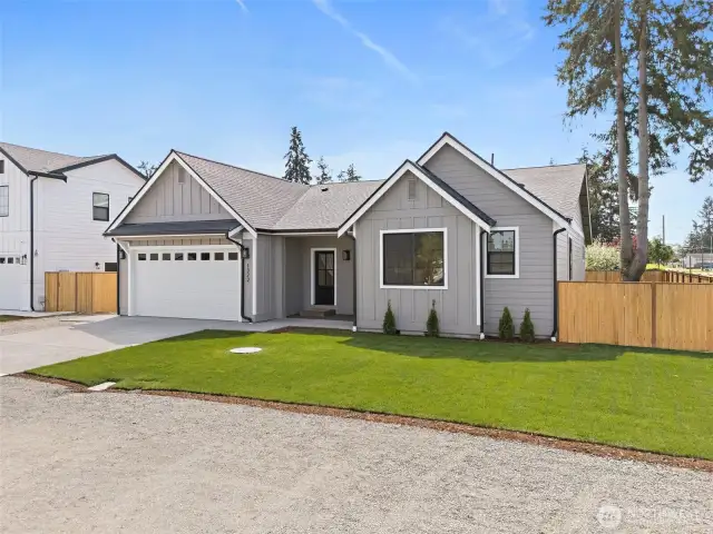 Beautiful privacy fence surrounds this home. Rich contrasting windows and lighting set the stage.