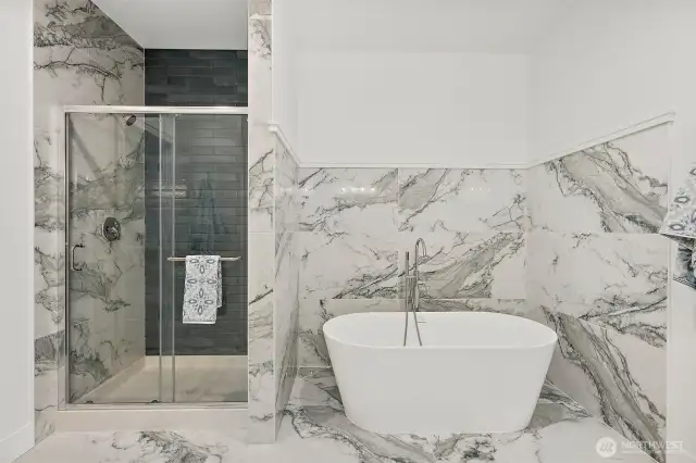 Relax in a hot bubble bath in this stylish freestanding tub.
