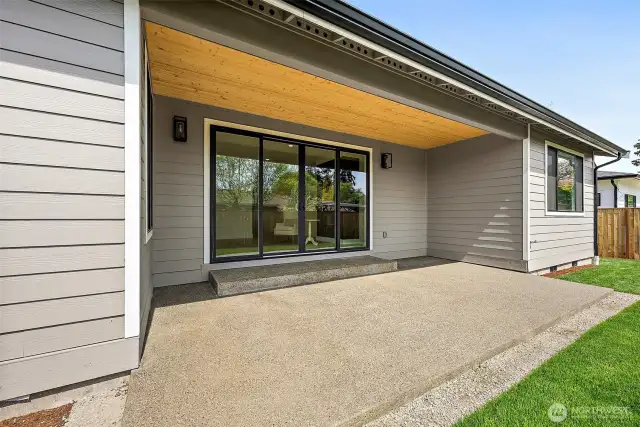 The covered back patio feels like an extension of the home with large sliders opening to the Great room. BBQ all year round with guests.