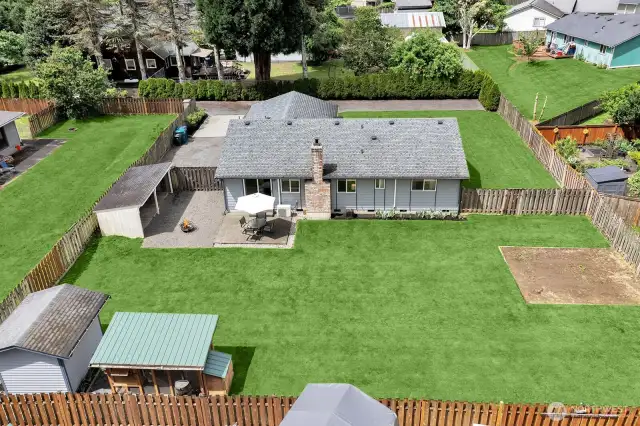 Aerial view of back of home and yard