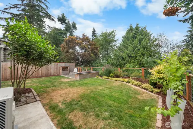 Sunny backyard with gardening space.
