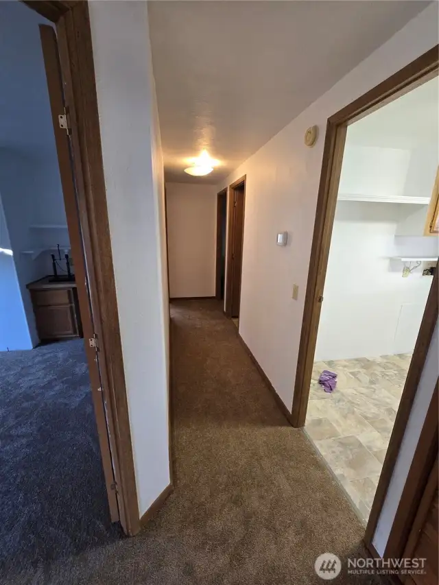 Hallway to utility room and continue to bedrooms