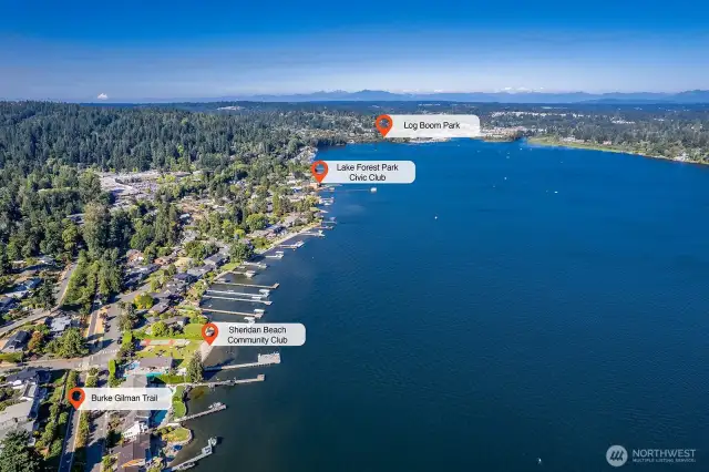 The Burke-Gilman Trail at the end of the block winds through the lakeside neighborhood of Sheridan Beach, followed by the Lake Forest Park Civic Club—both featuring private beaches and amenities for club members. Continue your adventure along the scenic, trail-side boardwalk to Log Boom Park, a public waterfront destination with a sandy beach, public dock, playground, picnic shelter, and boat rentals.