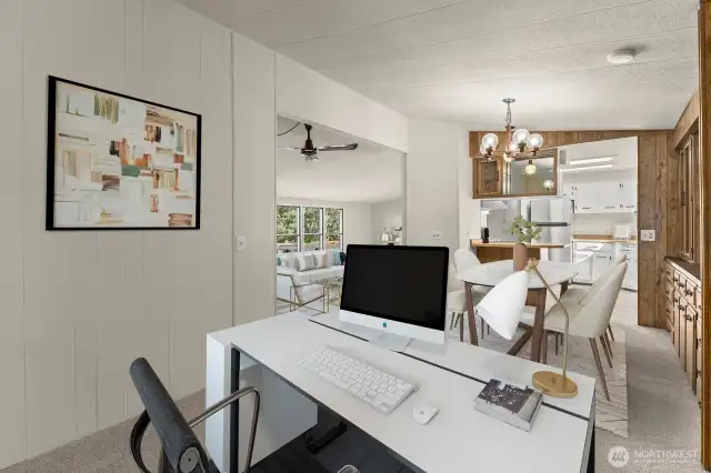 Looking back from the flex space into the dining, kitchen & living room. Virtually staged.