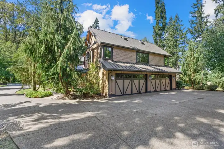 Lovely, Oversized four-car garage with abundant natural light, oversized doors, and man-door access to the patio. Includes separate golf-cart house or storage building, programmable exterior-light timers, and 75-gallon Rheem water heater — combining capacity with convenience.